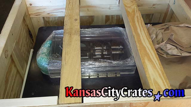 View of large supports  inside crate to safely stack during shipment