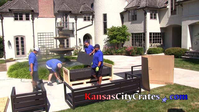Kansas City Crate personnel sealing gas patio fireplace in industrial vault crate