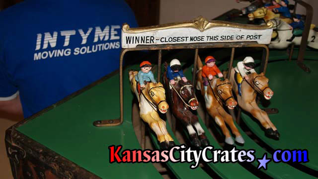 Close up of horses in Antique horse racing game before crating.