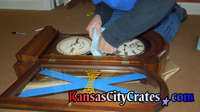 After pendulum is removed from clock small foam is placed on bell inside Seth Thomas Fashion Model No. 3  clock before packing into wood crate for international shipping at home in Loch LLoyd MO 64012