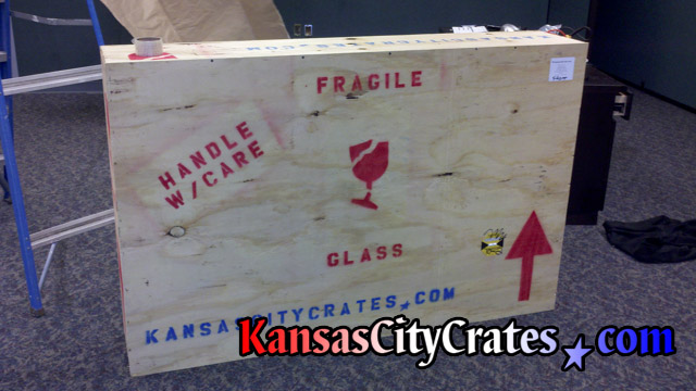 Stained glass window frame packed into indestructible box crate with shock sensor to alert handlers.