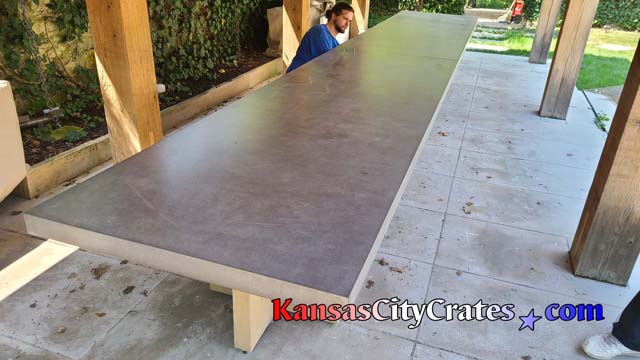 End view of 20 foot outdoor comcrete estate tables under Pergola at home in Mission Hills KS