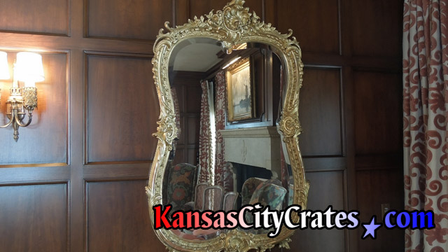 Mirror on wall in mansion before removal to pack in solid wall wooden crate for storage during rennovations at mansion in Mission Hills KS