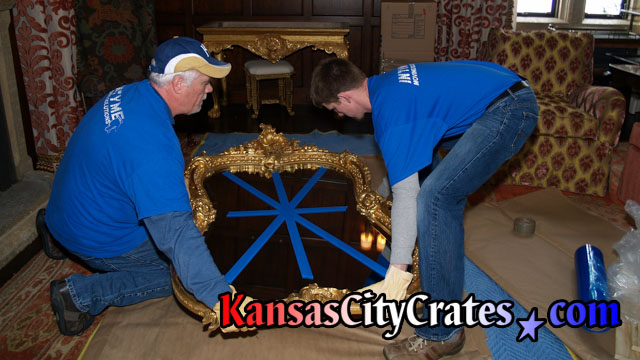 Mirrors are handled with lambskin gloves during the packing and crating process.
