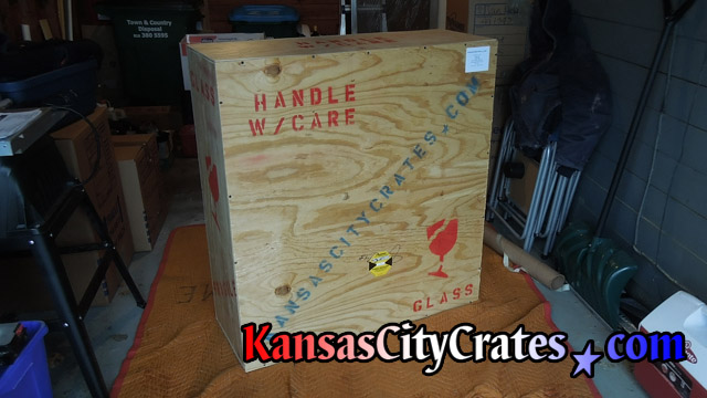 Vault like crate with solid wall protection for neon sign shipping to California.