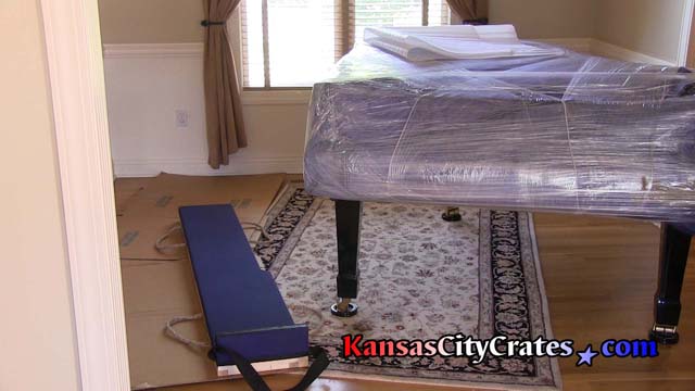 Body of piano is wrapped before crating