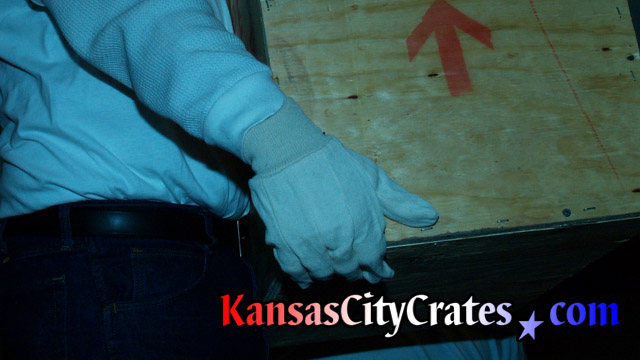 Example photo of handling different items with white gloves, or Kid gloves, so fingerprints and smudges are not left on its surface.