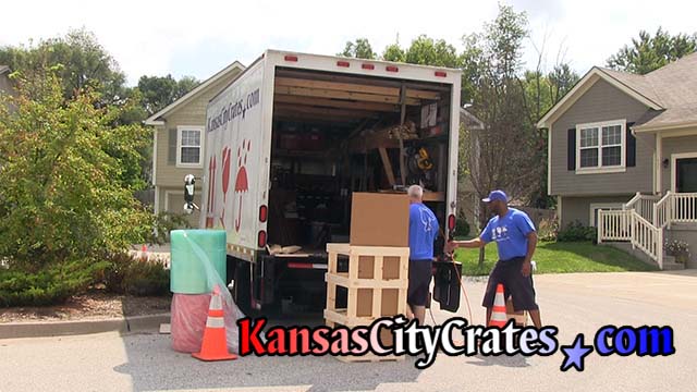 2 crate builders assemble wood domestic slat crate at home in Kansas City MO  64167