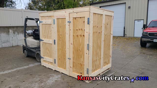 Large custom designed trade show crate being loaded onto tractor trailer with Crown C5 forklift