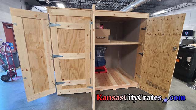 Side door view of loading trade show equipment into custom crate container