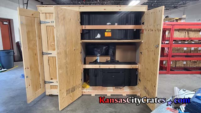 Side door view of trade show display equipment fully packed into custom crate container