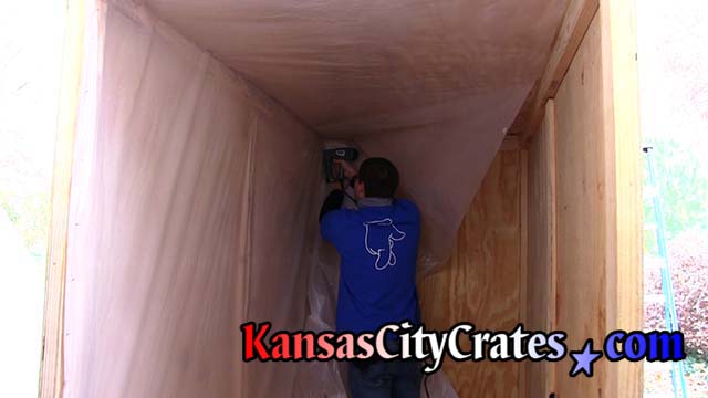 Crate builder adds heavy plastic lining in vault to prevent moisture damage to contents